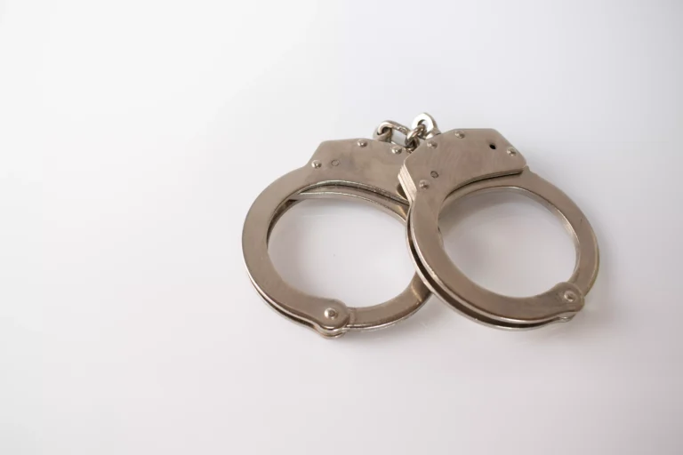 1071586-high-angle-shot-metal-handcuffs-isolated